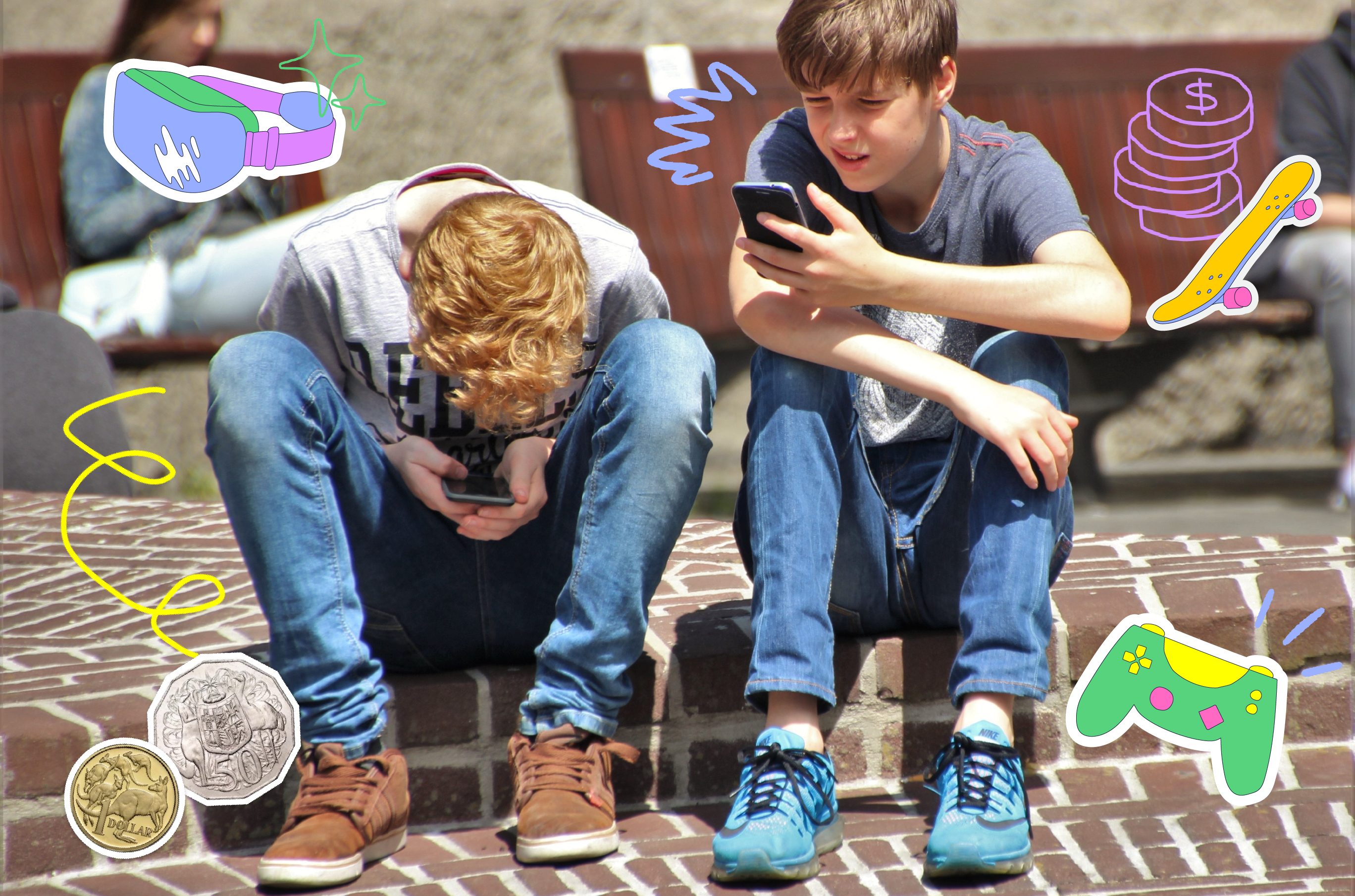 Two boys sitting outside in the sun, using their mobile phones